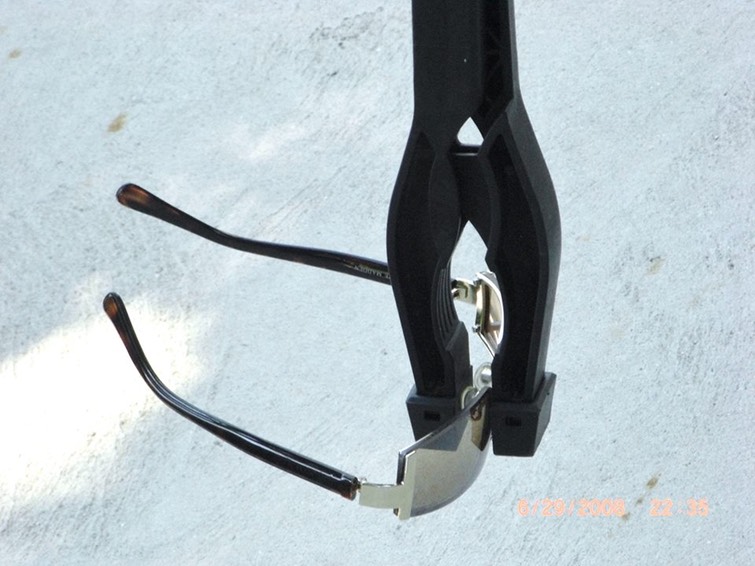 picking up sunglasses